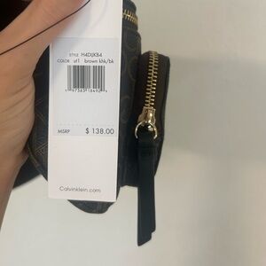 Calvin Klein brown fanny pack, brand new tags still on.